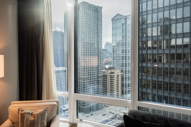 a view of a balcony with a floor to ceiling window