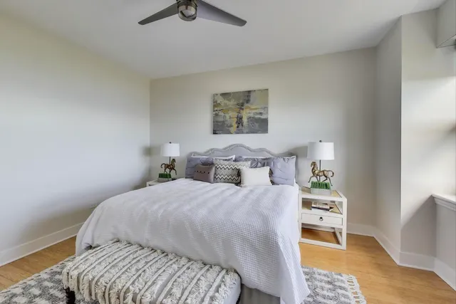 a bathroom with a granite countertop toilet a sink and shower