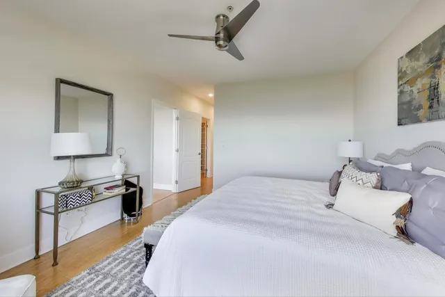 a bedroom with bed and a window