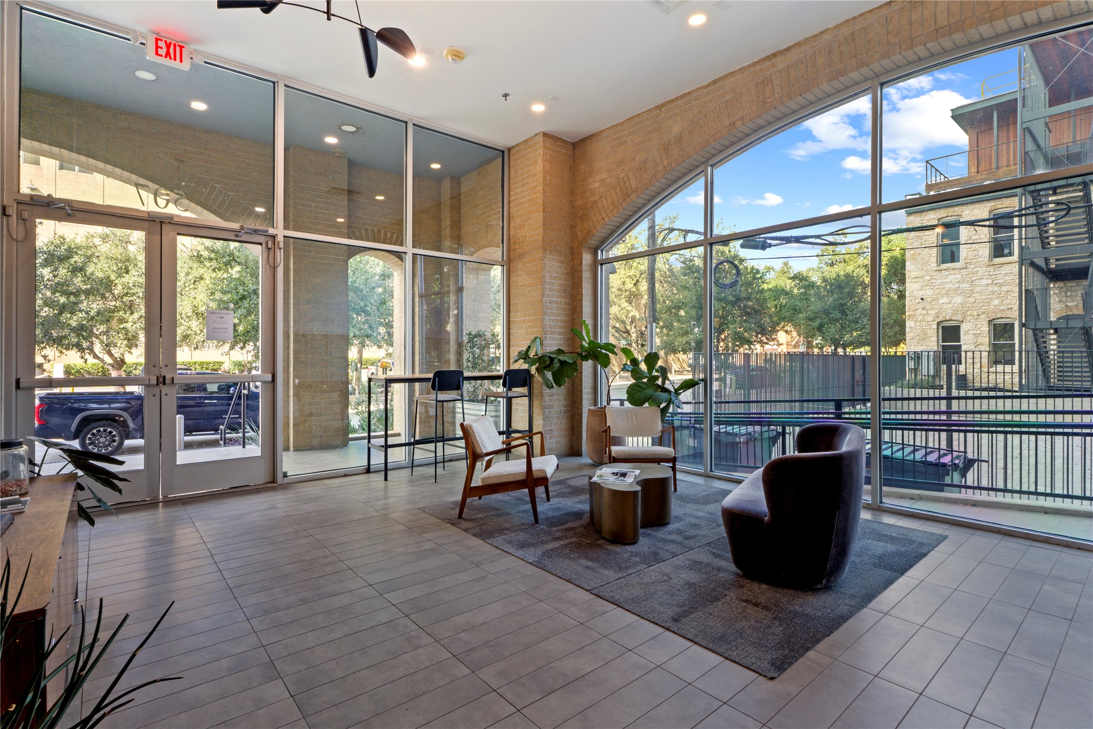 507 Sabine Street, Unit 509 Austin, TX 78701 - Photo 23 of 23 Community lobby with floor to ceiling windows, recessed lighting, and a towering ceiling