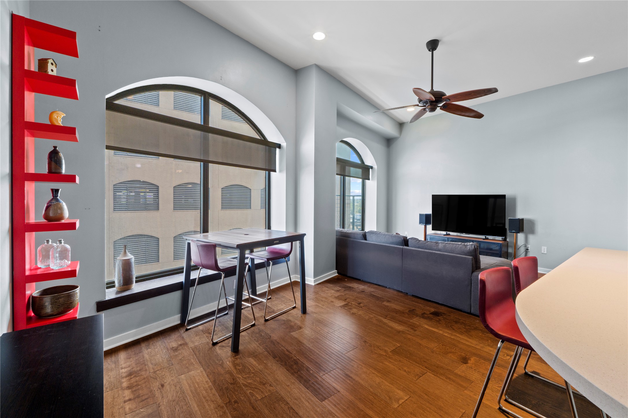 507 Sabine Street, Unit 509 Austin, TX 78701 - Photo 10 of 23 Living area with a desk, dark wood-type flooring, a ceiling fan, and recessed lighting
