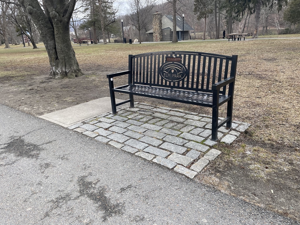 136 Russell Street, Unit 1A Worcester, MA 01609 - Photo 13 of 17 a view of a bench in a backyard