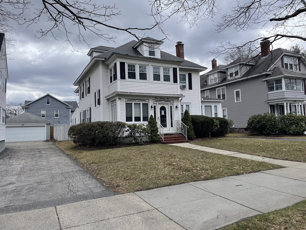 136 Russell Street, Unit 1A Worcester, MA 01609 - Photo 17 of 17 a view of a white house with a outdoor space