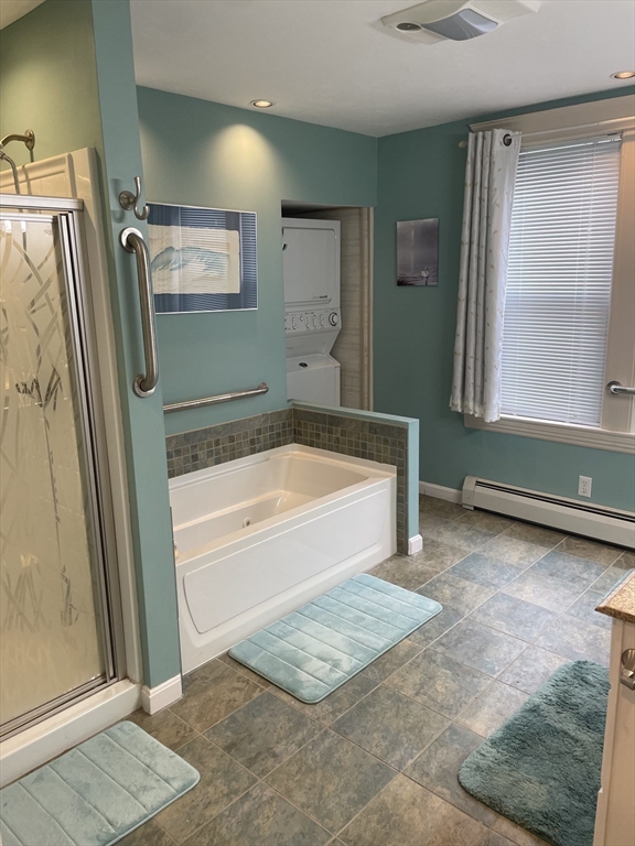 136 Russell Street, Unit 1A Worcester, MA 01609 - Photo 7 of 17 a bathroom with a bathtub and a shower