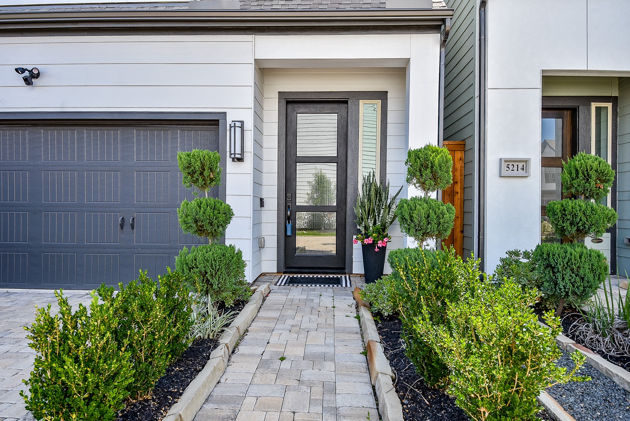 950 Ford Pines Lane Houston, TX 77091 - Photo 3 of 38 Gorgeous landscaping leading to the contemporary glass front door.