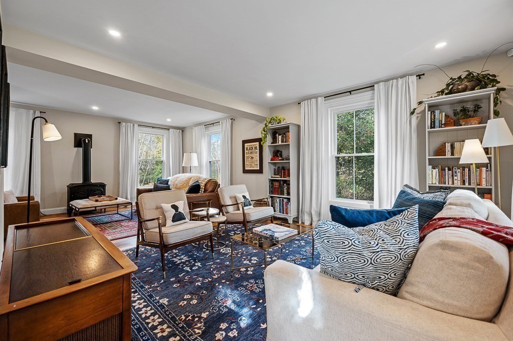 13 Blackstone Street Mendon, MA 01756 - Photo 2 of 41 a living room with furniture or couch and a bookshelf