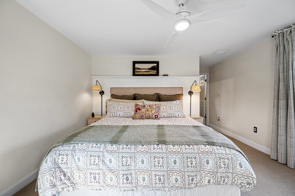 13 Blackstone Street Mendon, MA 01756 - Photo 22 of 41 a view of a bedroom with a bed and wooden floor