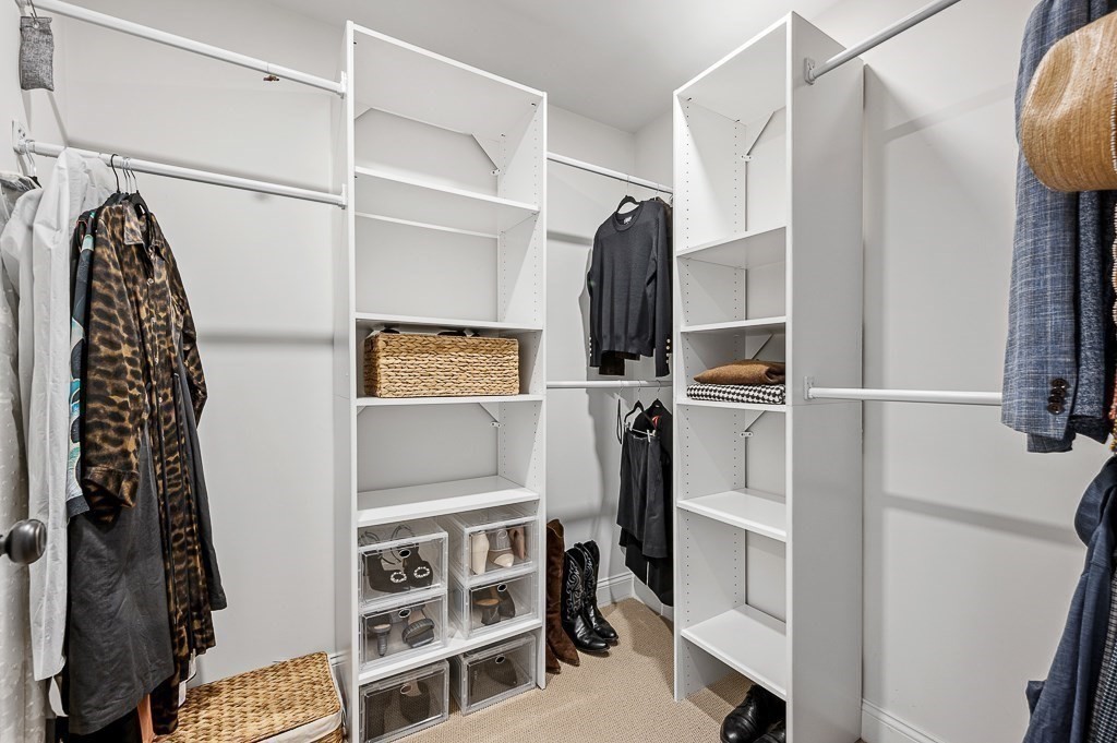 13 Blackstone Street Mendon, MA 01756 - Photo 23 of 41 a view of walk in closet with clothes and shoes