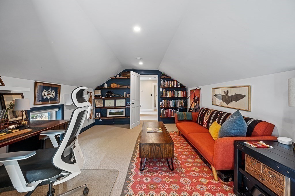 13 Blackstone Street Mendon, MA 01756 - Photo 28 of 41 a living room with furniture gym equipment and a rug