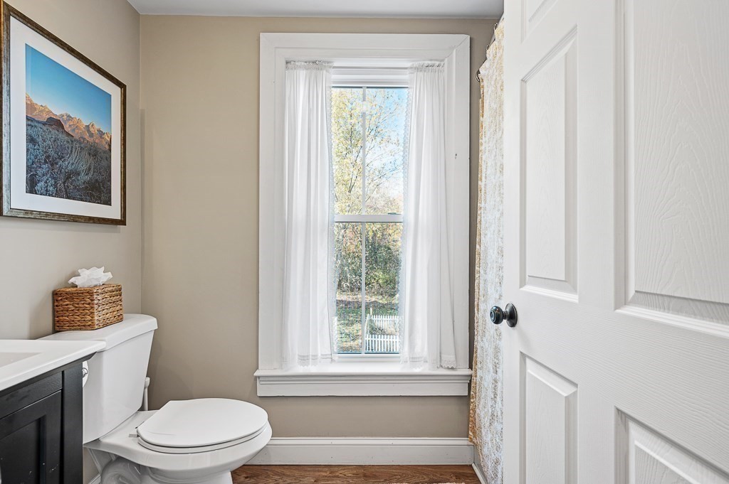 13 Blackstone Street Mendon, MA 01756 - Photo 30 of 41 a bathroom with a toilet a sink and a window