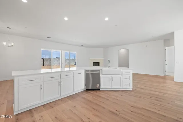 a bathroom with a sink a window and a mirror