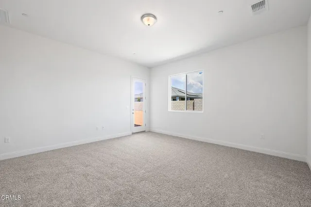 a view of an empty room and closet