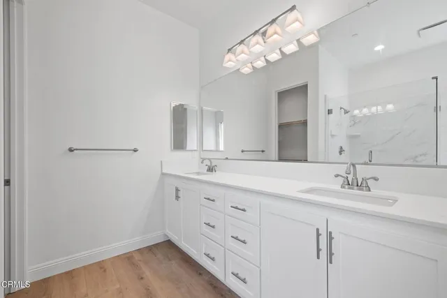 a bathroom with a tub and shower