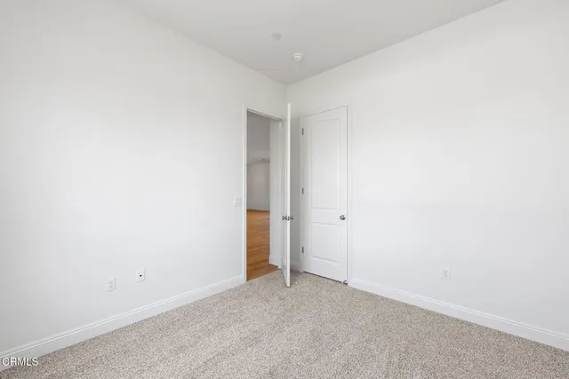 a view of wooden floor in an empty room