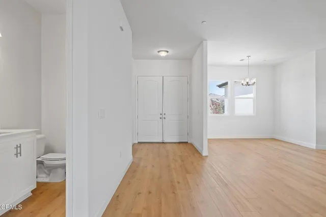 a view of a kitchen with a sink and a large window