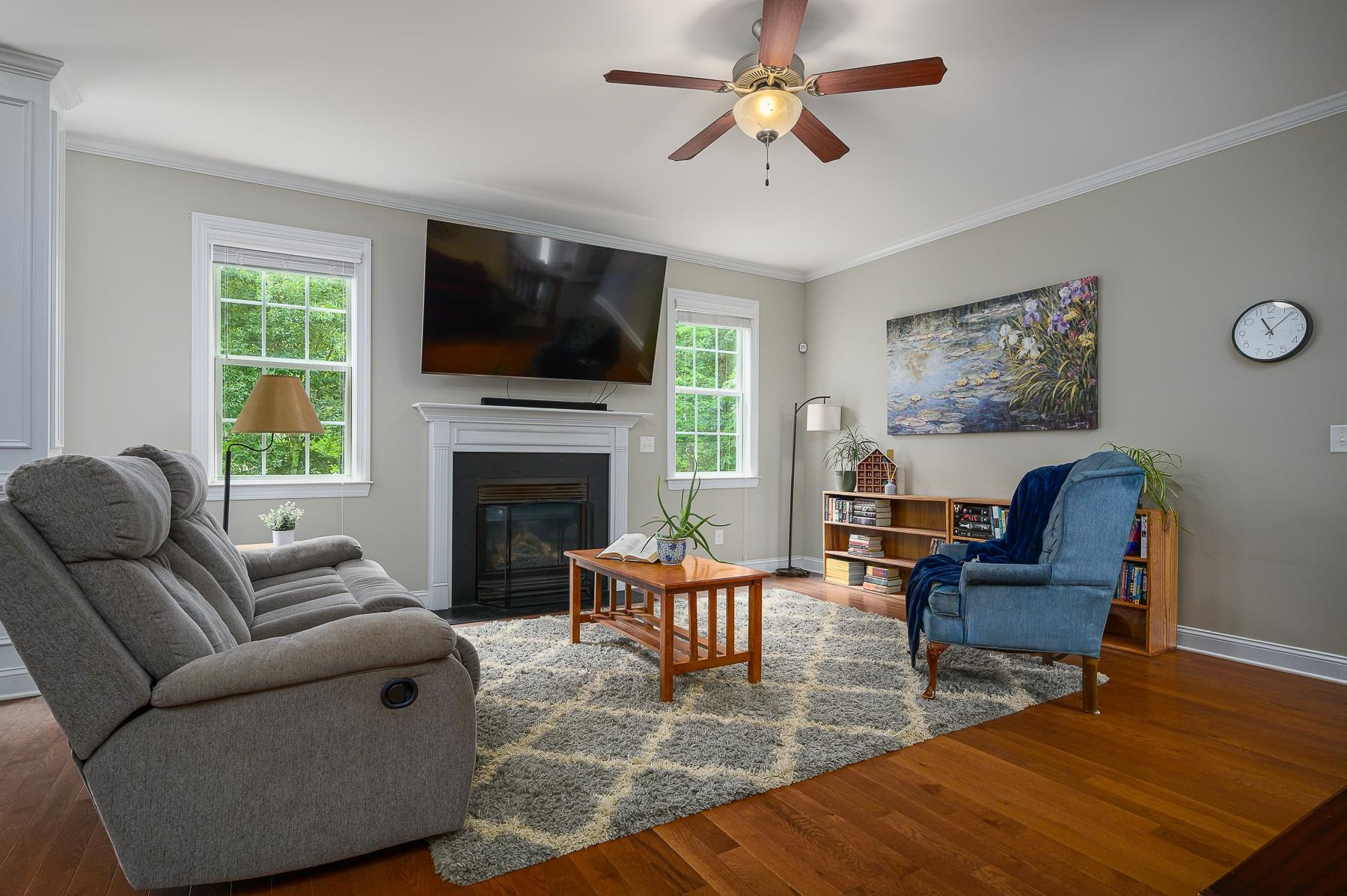 413 Mickey Lane Cary, NC 27513 - Photo 11 of 35 a living room with furniture fireplace and a flat screen tv