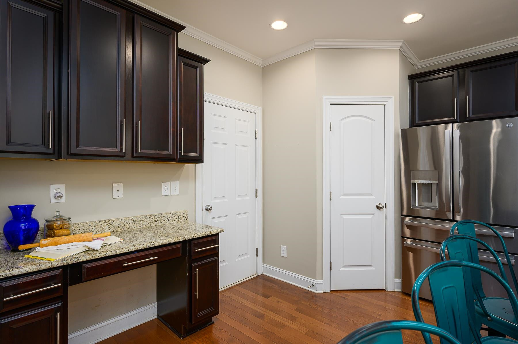 413 Mickey Lane Cary, NC 27513 - Photo 16 of 35 a kitchen with stainless steel appliances granite countertop a refrigerator and a sink
