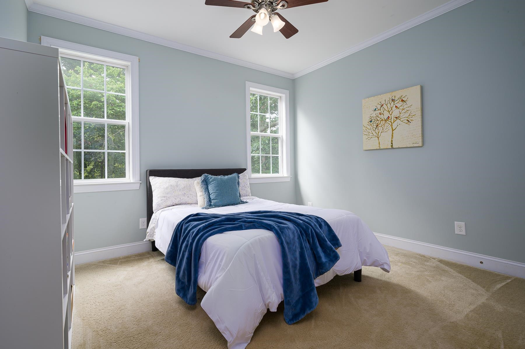 413 Mickey Lane Cary, NC 27513 - Photo 18 of 35 a bed sitting in a bedroom next to a window