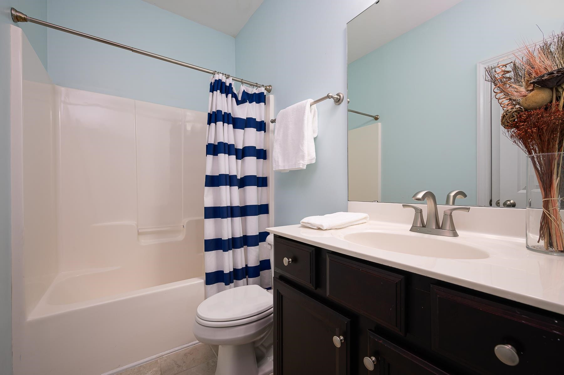 413 Mickey Lane Cary, NC 27513 - Photo 19 of 35 a bathroom with a sink a toilet and shower