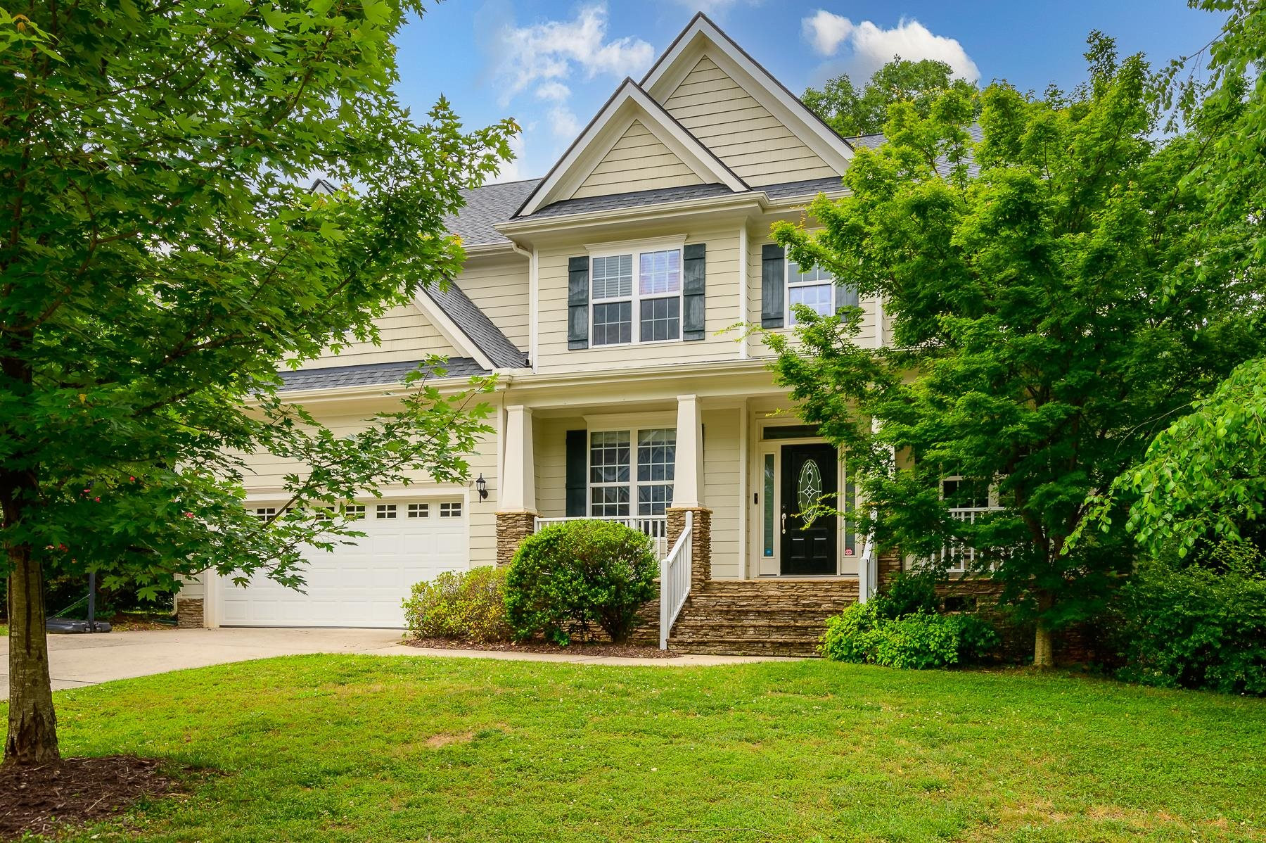 413 Mickey Lane Cary, NC 27513 - Photo 2 of 35 a front view of a house with a yard
