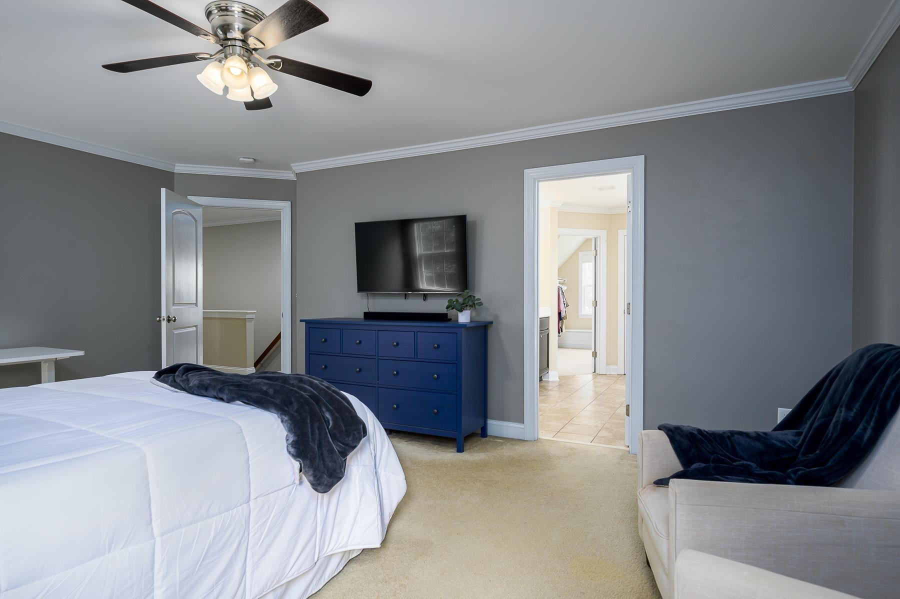 413 Mickey Lane Cary, NC 27513 - Photo 21 of 35 a bedroom with a bed and a flat screen tv
