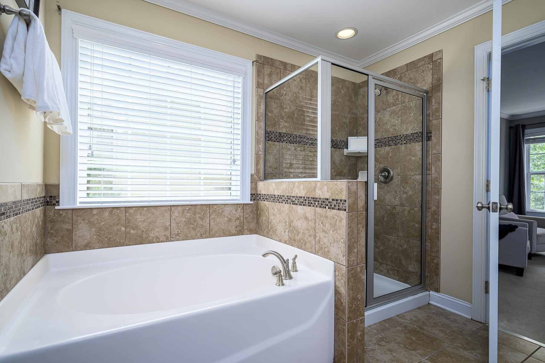 413 Mickey Lane Cary, NC 27513 - Photo 23 of 35 a bathroom with a bathtub and a shower