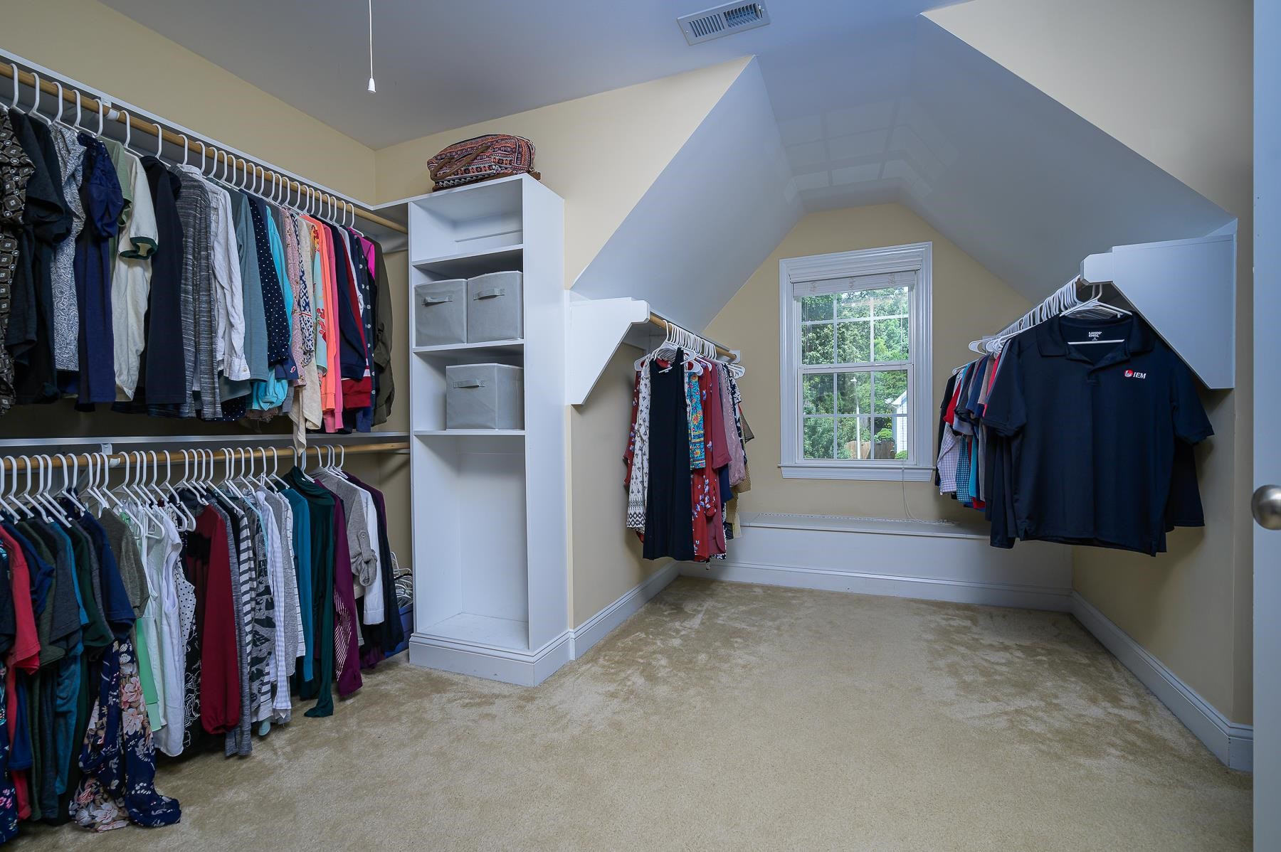 413 Mickey Lane Cary, NC 27513 - Photo 24 of 35 a view of walk in closet with clothes and shoes