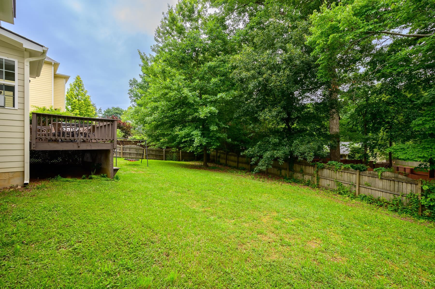 413 Mickey Lane Cary, NC 27513 - Photo 33 of 35 a view of a house with a backyard