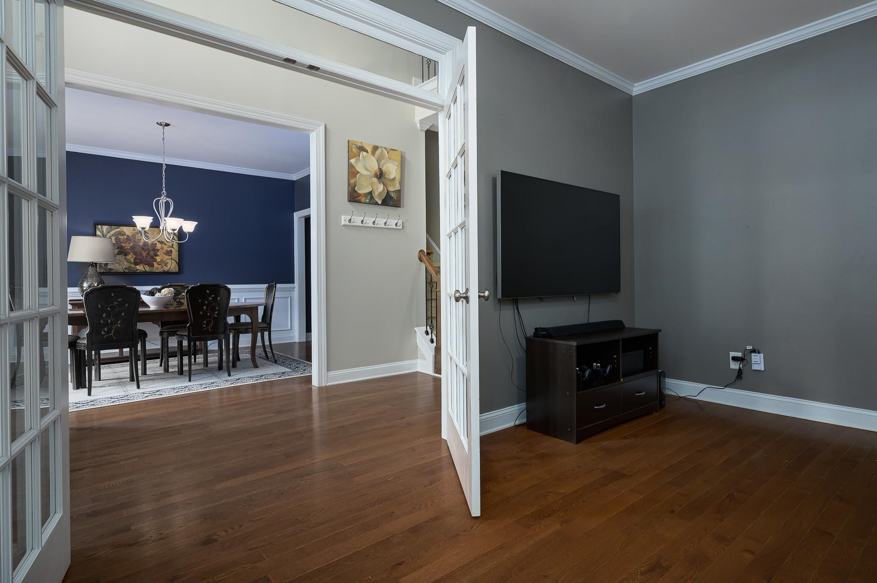 413 Mickey Lane Cary, NC 27513 - Photo 9 of 35 a living room with furniture and a flat screen tv