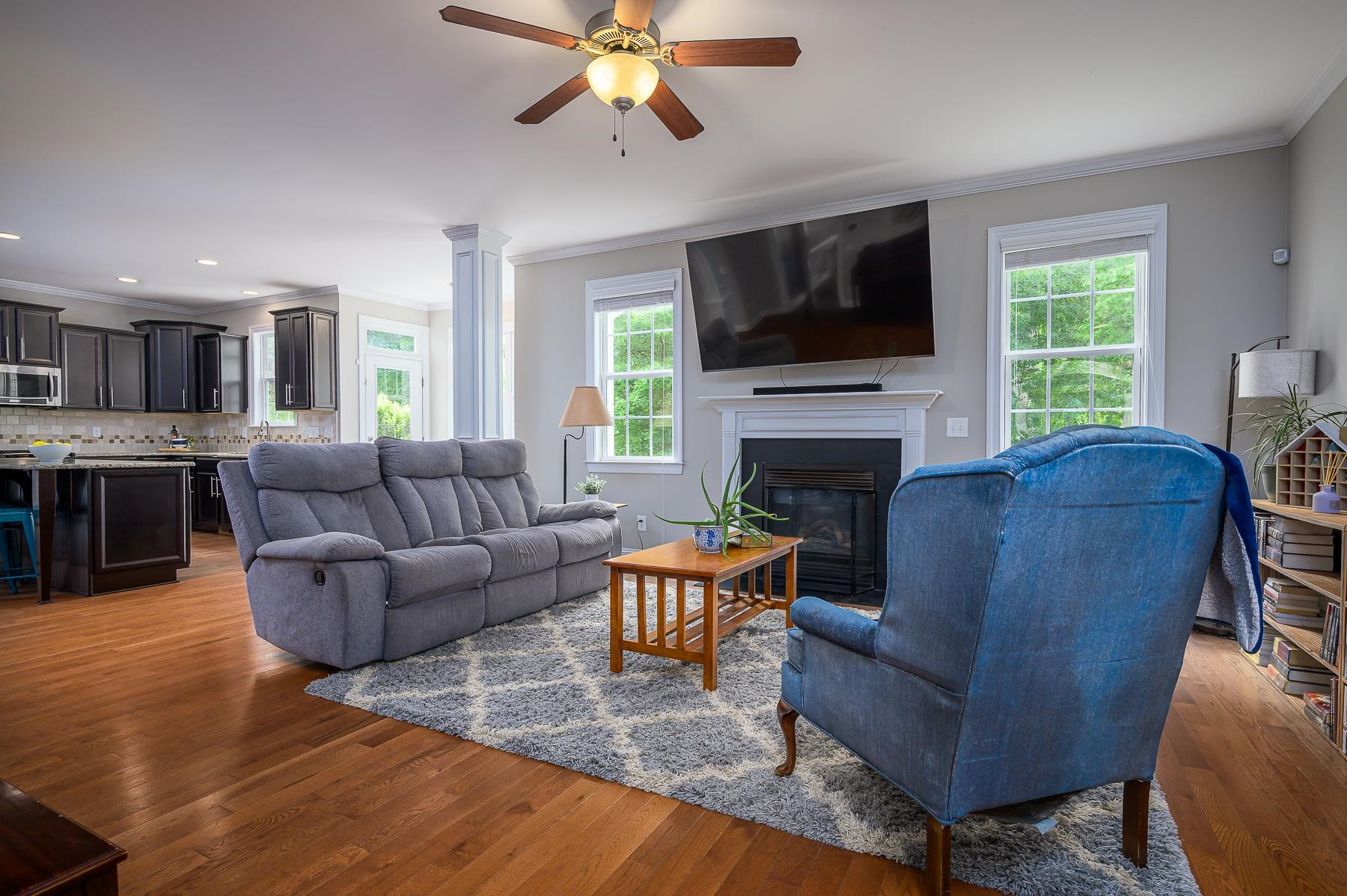413 Mickey Lane Cary, NC 27513 - Photo 10 of 35 a living room with fireplace furniture and a flat screen tv