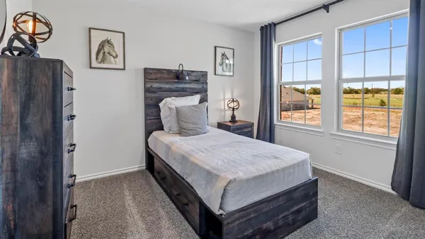 a bedroom with a bed and a table in it