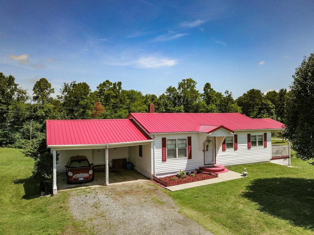 3015 Deal Mill Road Hudson, NC 28638 - Photo 1 of 34 a view of a house with swimming pool and porch