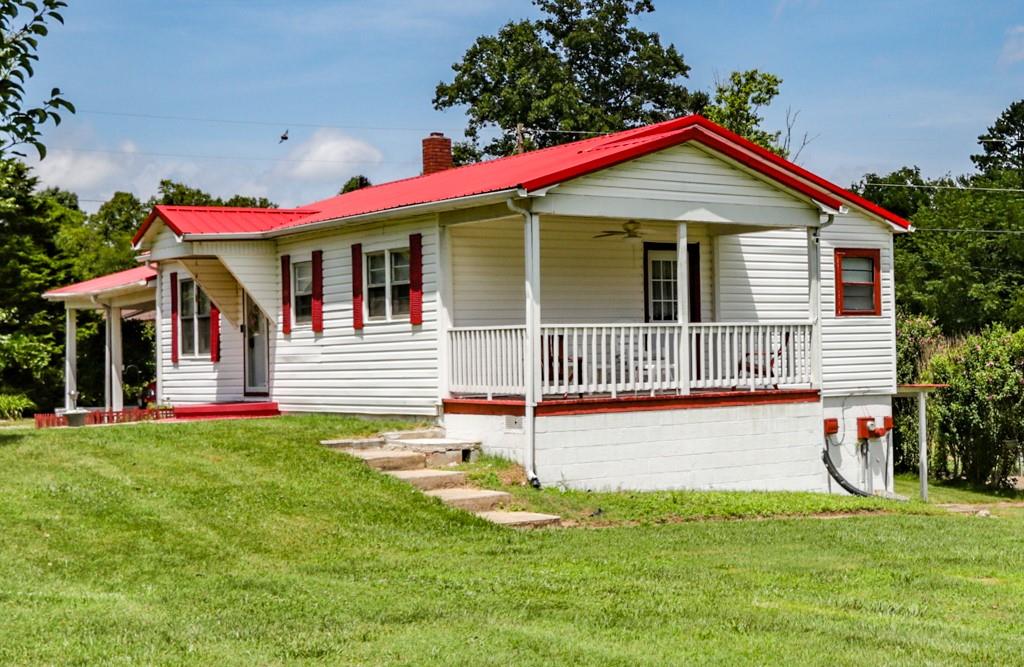3015 Deal Mill Road Hudson, NC 28638 - Photo 13 of 34 a view of a house with a yard and plants