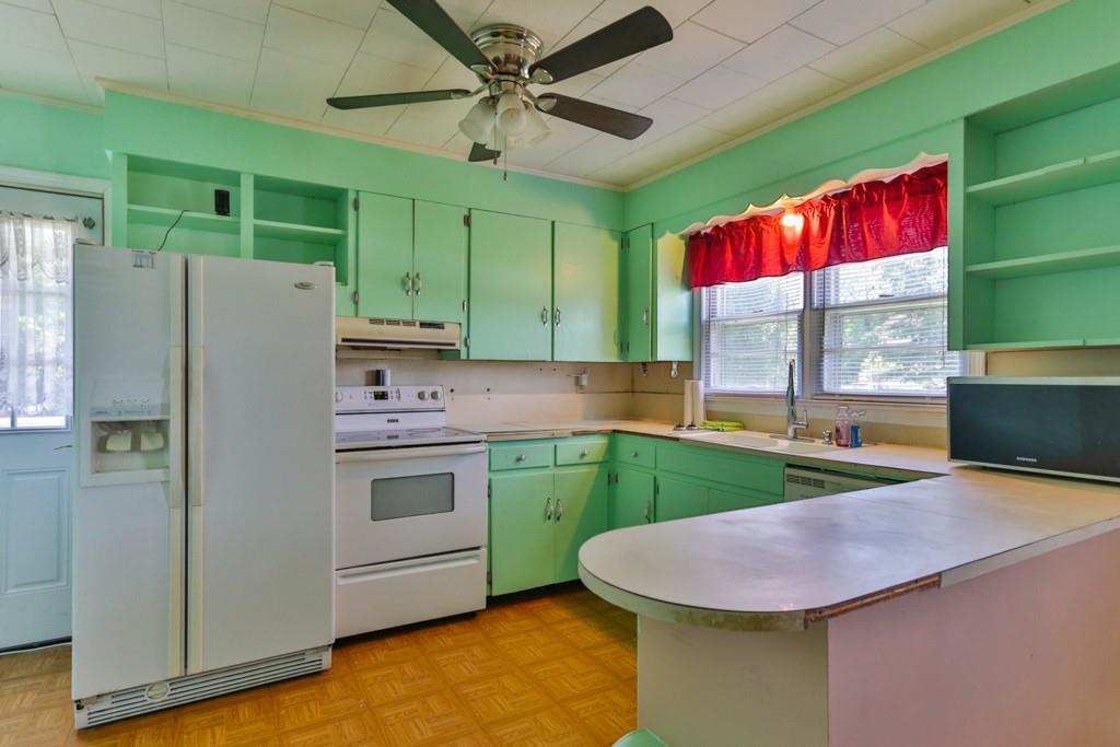 3015 Deal Mill Road Hudson, NC 28638 - Photo 19 of 34 a kitchen with a refrigerator and a sink