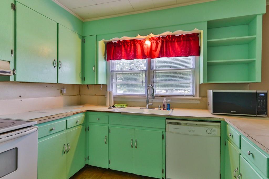 3015 Deal Mill Road Hudson, NC 28638 - Photo 20 of 34 a kitchen with a sink and a microwave