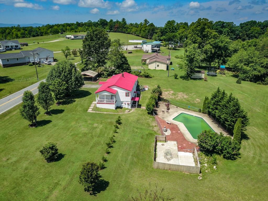 3015 Deal Mill Road Hudson, NC 28638 - Photo 4 of 34 an aerial view of residential houses with outdoor space and street view