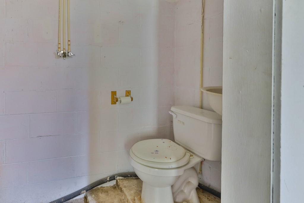 3015 Deal Mill Road Hudson, NC 28638 - Photo 33 of 34 a white toilet sitting next to a shower