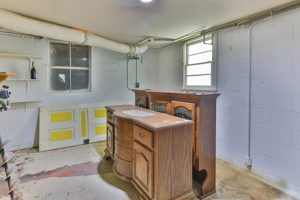 3015 Deal Mill Road Hudson, NC 28638 - Photo 34 of 34 a utility room with stainless steel appliances kitchen island granite countertop a stove a sink and a refrigerator