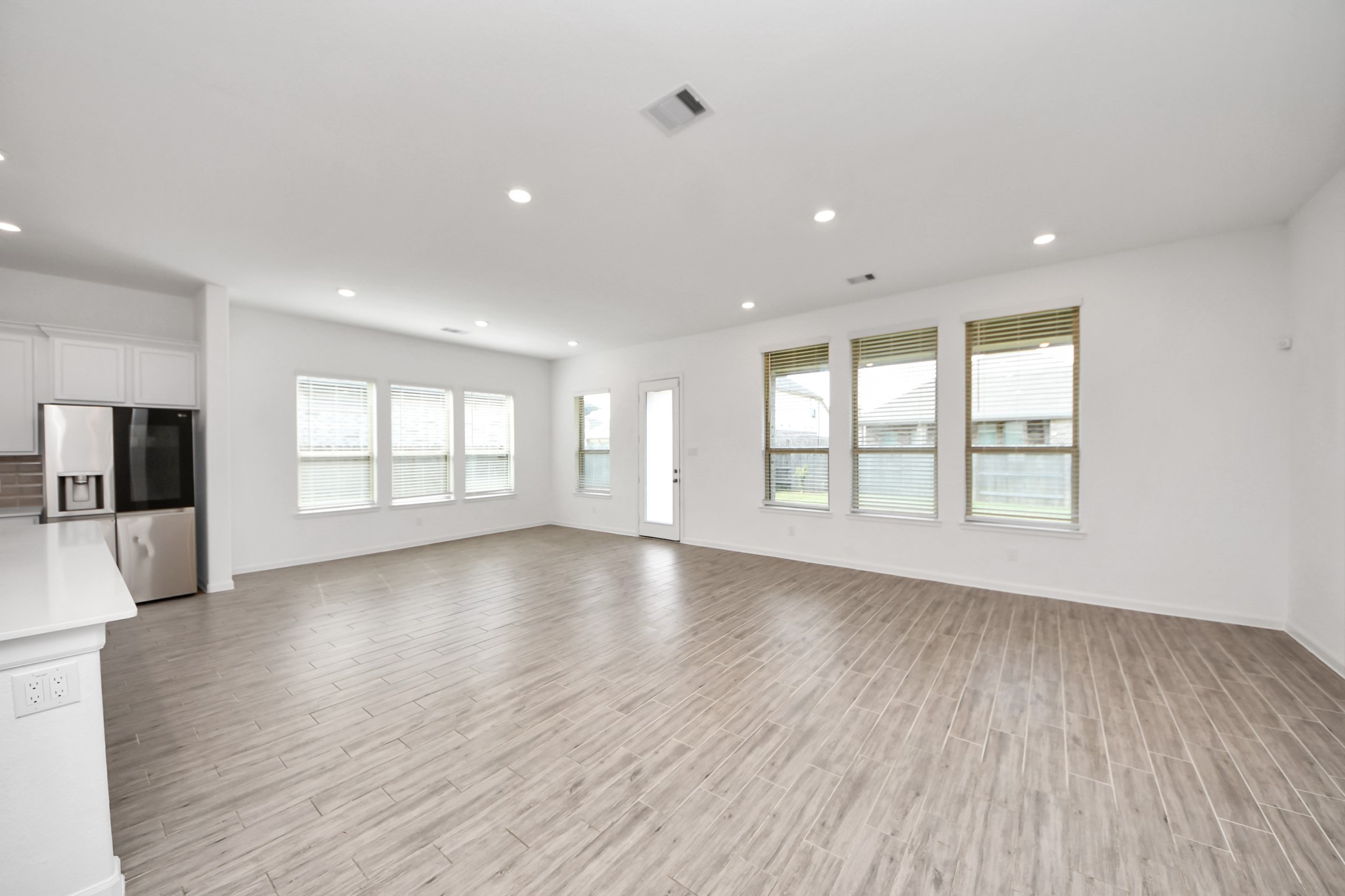 17770 Misty Brook Lane Conroe, TX 77302 - Photo 15 of 50 a view of an empty room with wooden floor and a window