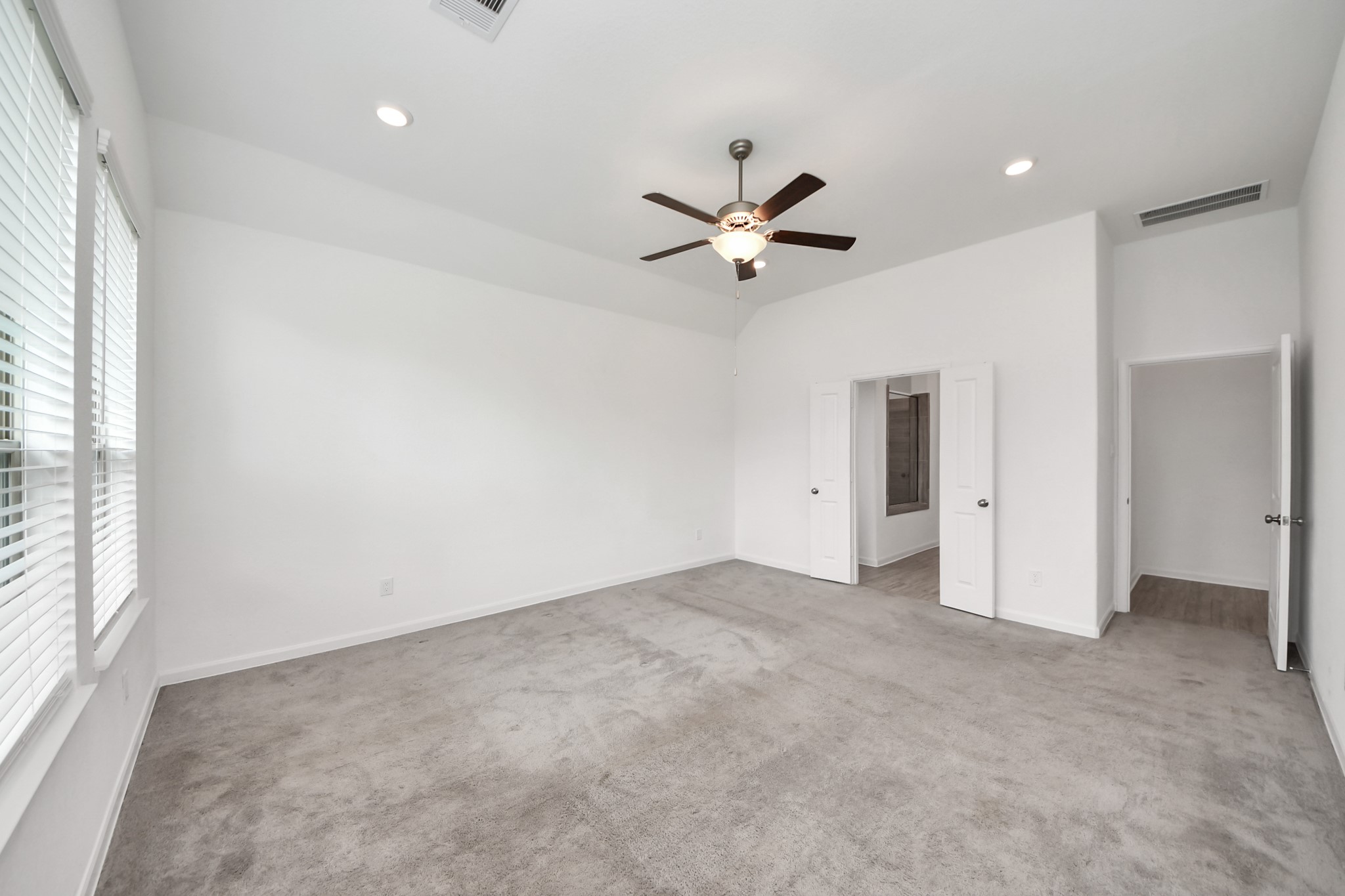 17770 Misty Brook Lane Conroe, TX 77302 - Photo 21 of 50 an empty room with a ceiling fan and a window