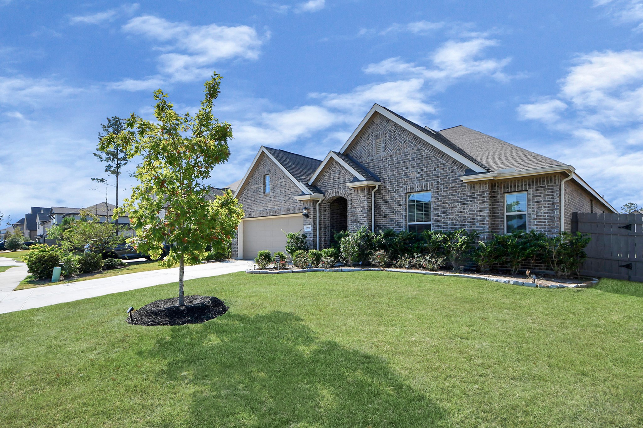 17770 Misty Brook Lane Conroe, TX 77302 - Photo 2 of 50 a front view of a house with a yard