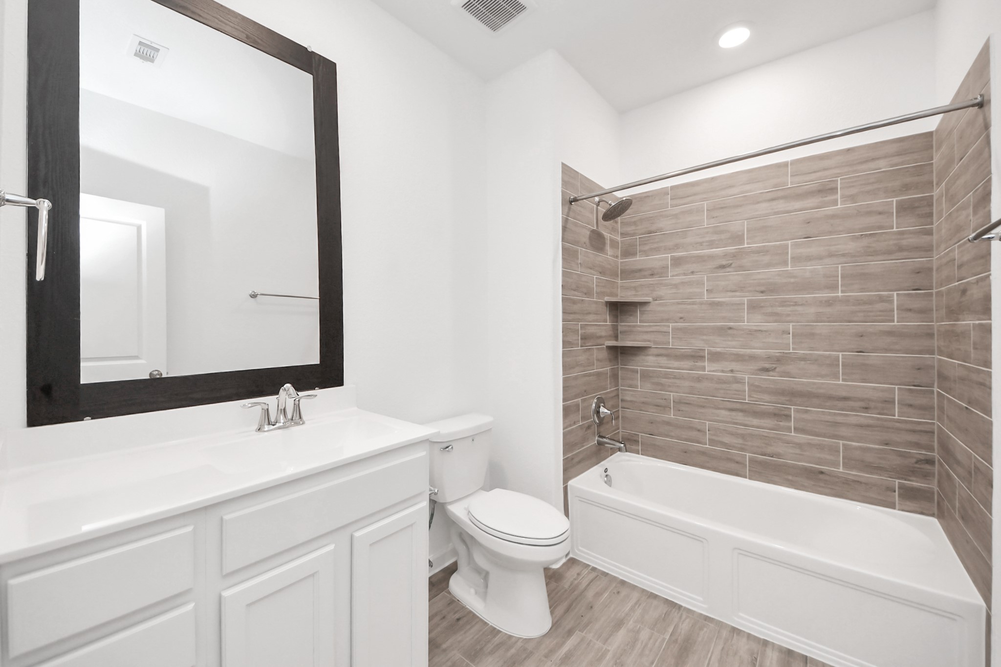 17770 Misty Brook Lane Conroe, TX 77302 - Photo 30 of 50 a bathroom with a sink a toilet and a bathtub