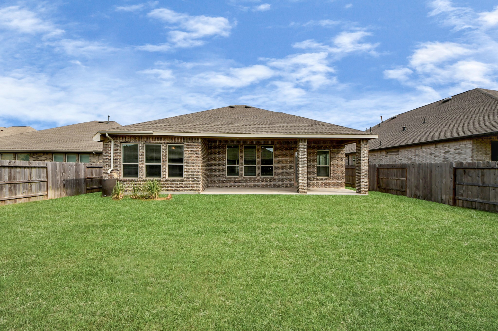 17770 Misty Brook Lane Conroe, TX 77302 - Photo 34 of 50 a front view of a house with a garden