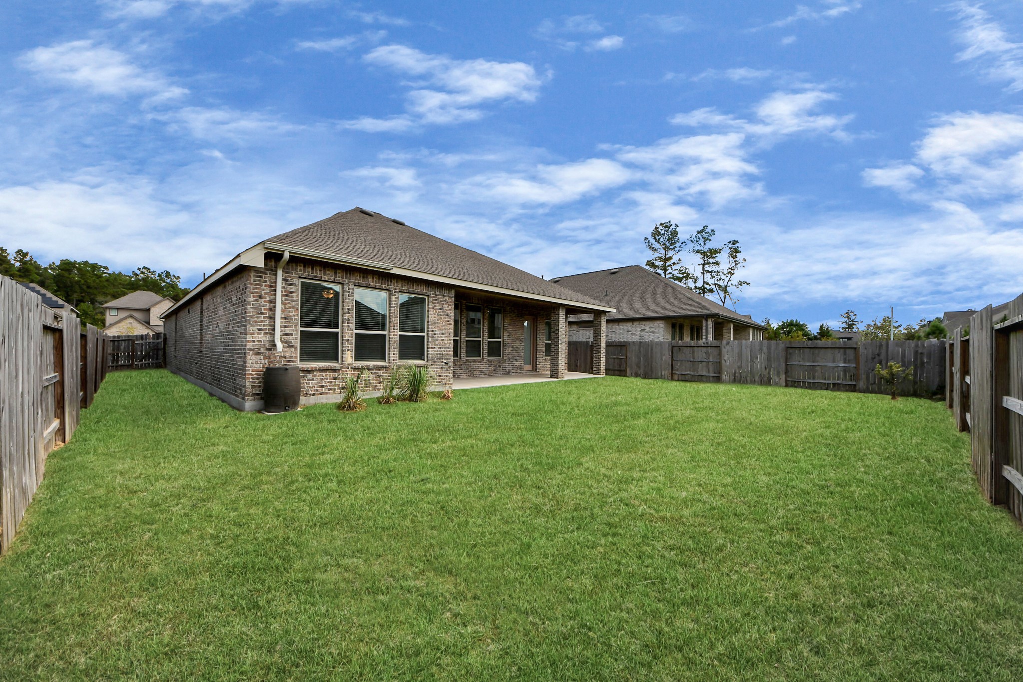 17770 Misty Brook Lane Conroe, TX 77302 - Photo 35 of 50 a front view of a house with a garden