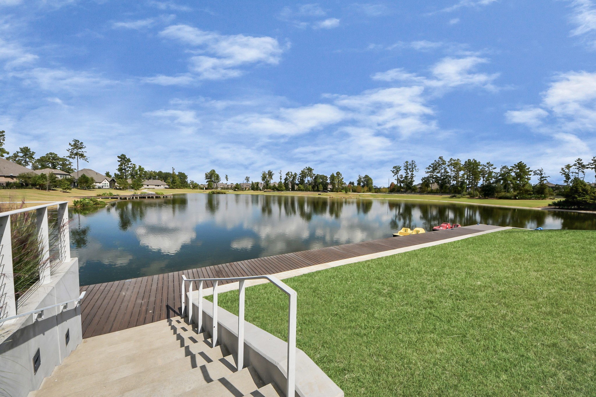 17770 Misty Brook Lane Conroe, TX 77302 - Photo 44 of 50 a view of a lake with houses in the back