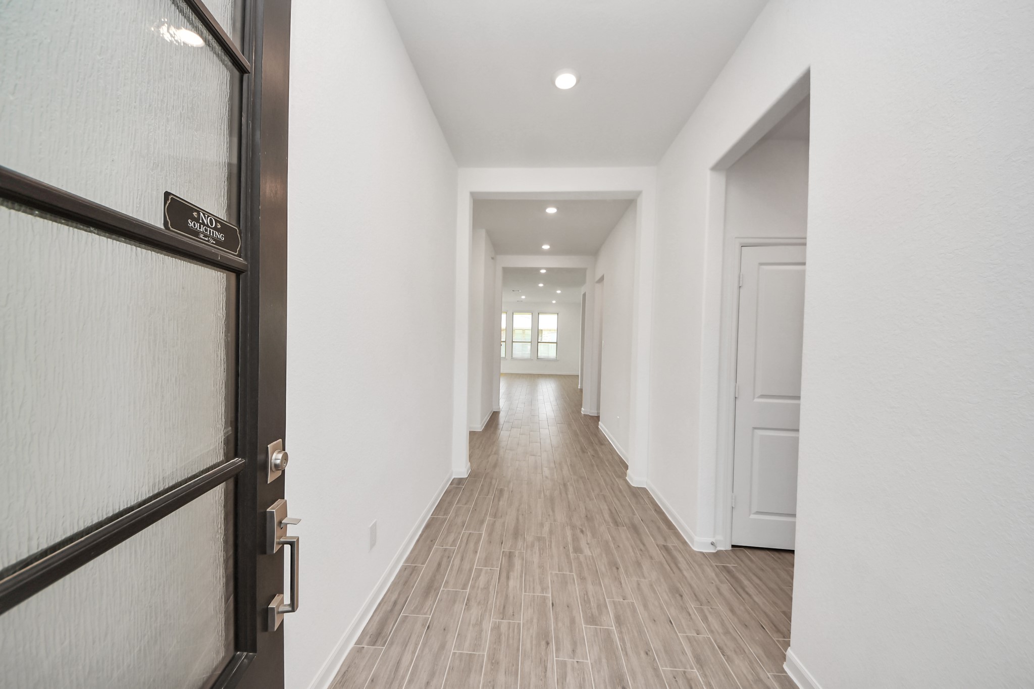 17770 Misty Brook Lane Conroe, TX 77302 - Photo 5 of 50 a view of a hallway with wooden floor