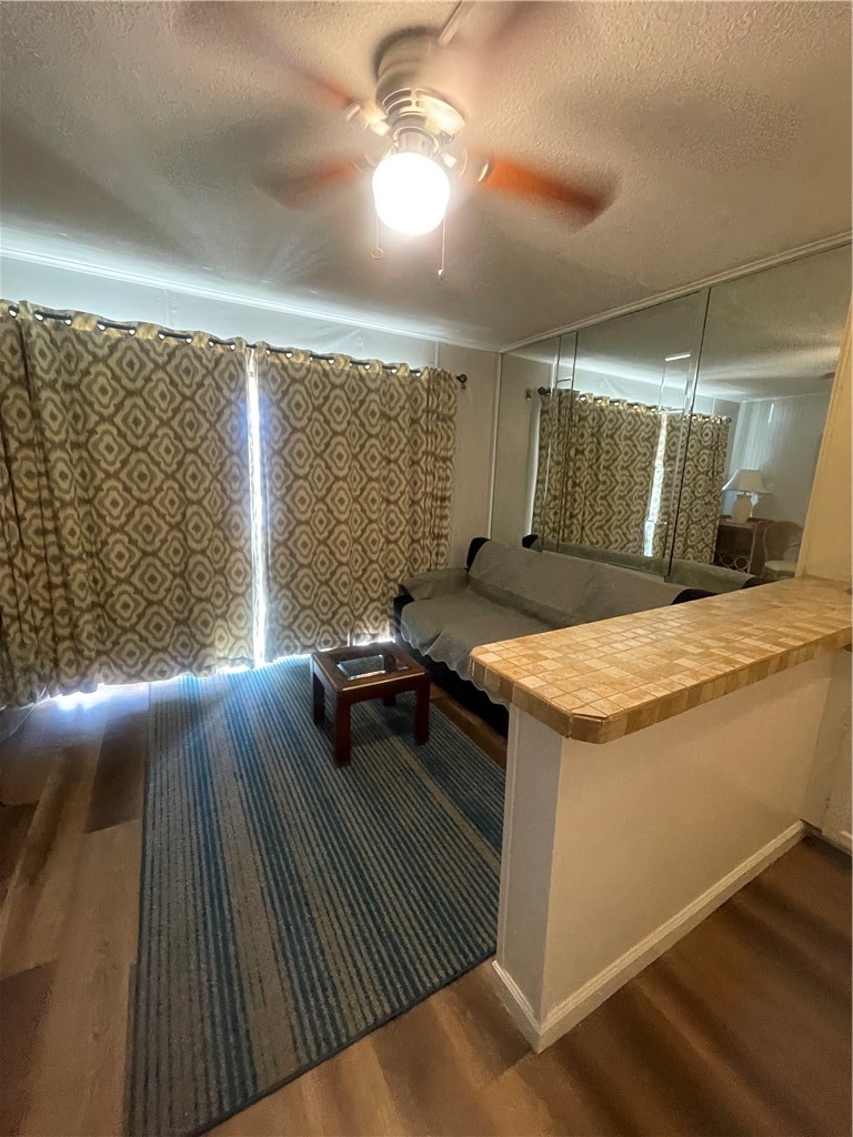 3938 Surfside Boulevard Corpus Christi, TX 78402 - Photo 3 of 12 a bedroom with a bed and a chandelier