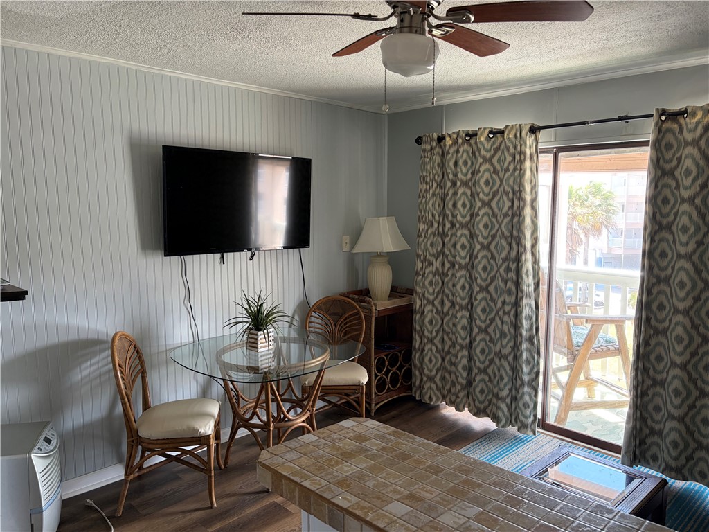 3938 Surfside Boulevard Corpus Christi, TX 78402 - Photo 6 of 12 a living room with furniture and a flat screen tv