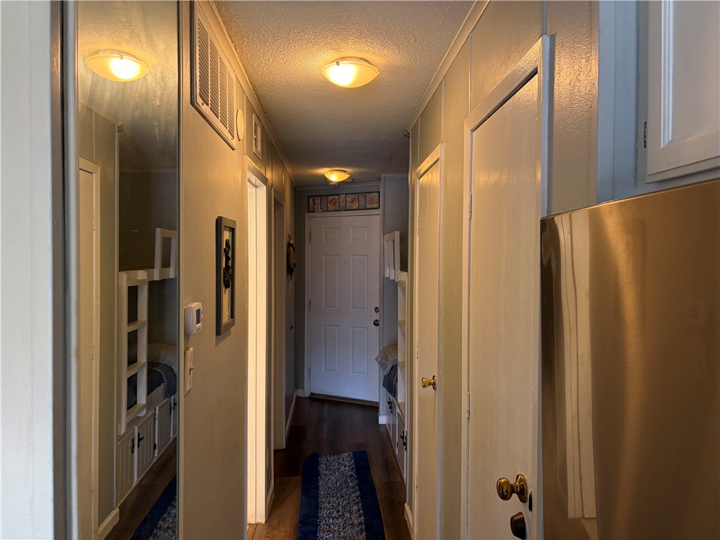 3938 Surfside Boulevard Corpus Christi, TX 78402 - Photo 7 of 12 a bathroom with a glass door shower and a sink