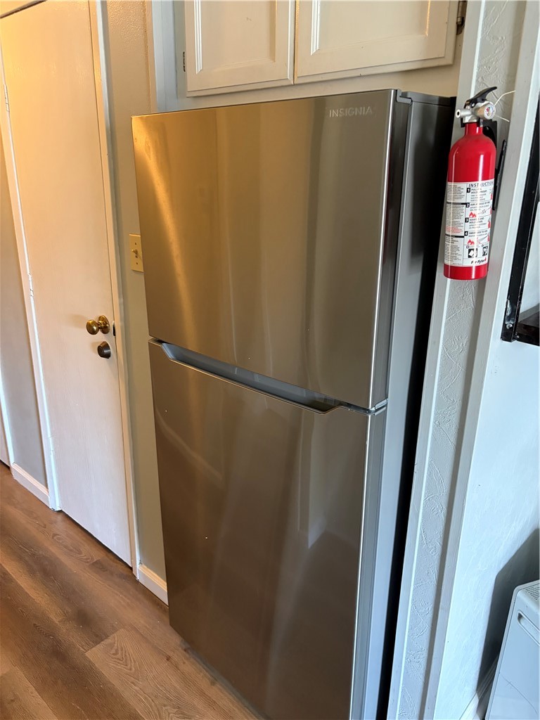 3938 Surfside Boulevard Corpus Christi, TX 78402 - Photo 10 of 12 a view of refrigerator with wooden floor